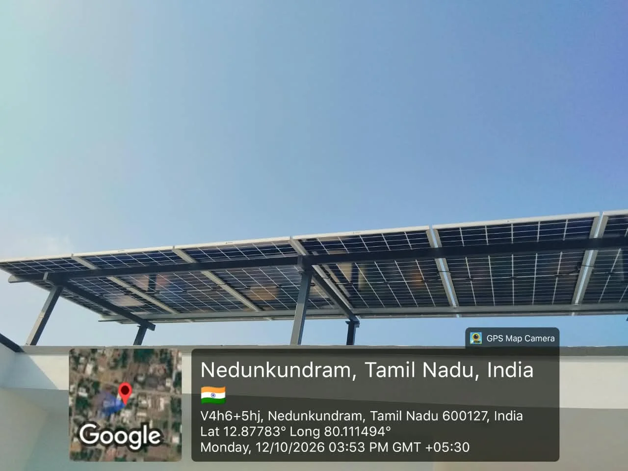 Full-terrace elevated solar array at Nedunkundram, near Tambaram, Chennai — rooftop solar installation for a home by Gensolar Energy Pvt Ltd, photographed 12 October 2026.