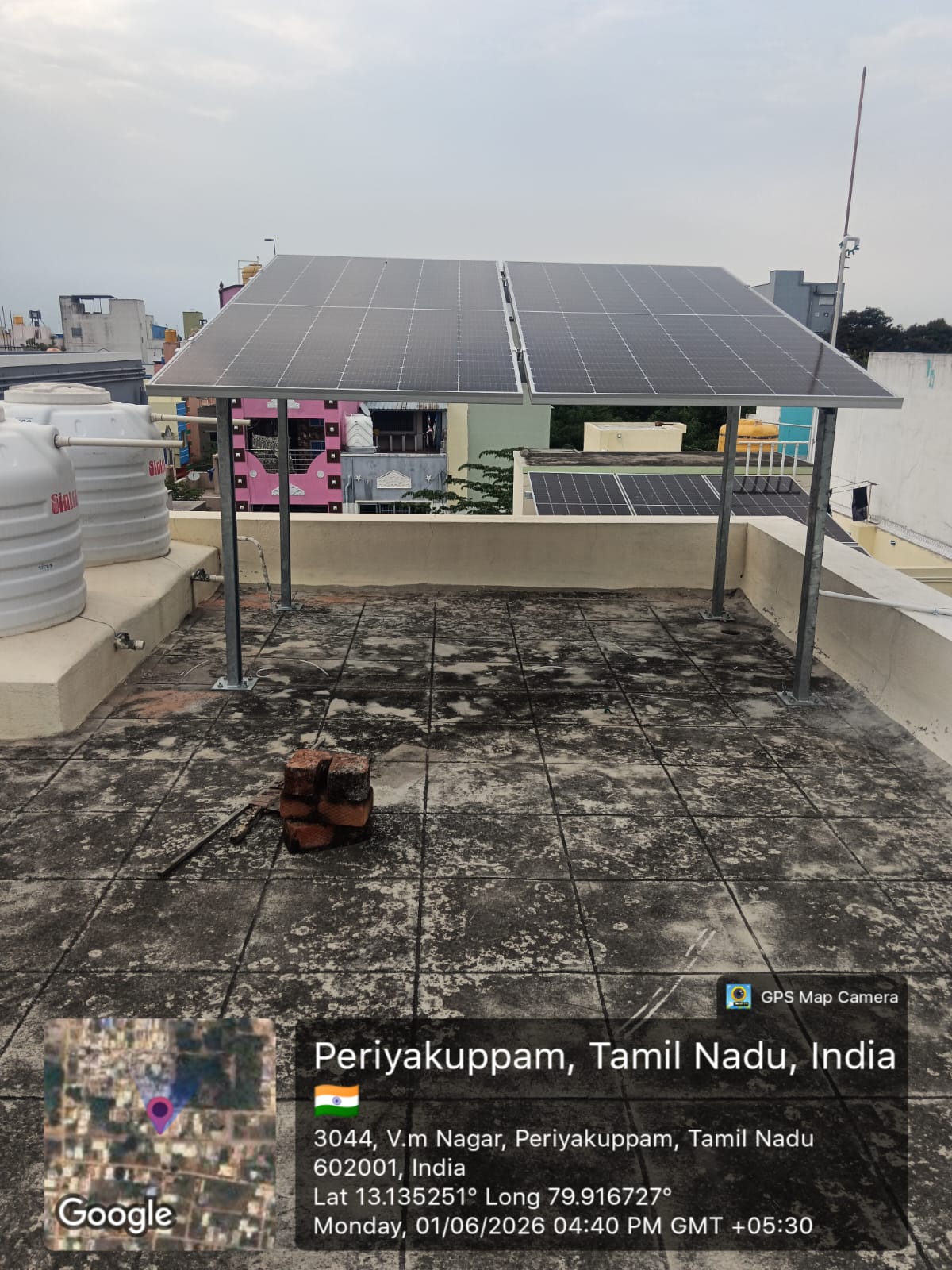 Solar installation at V.M Nagar, Periyakuppam — elevated terrace solar structure.