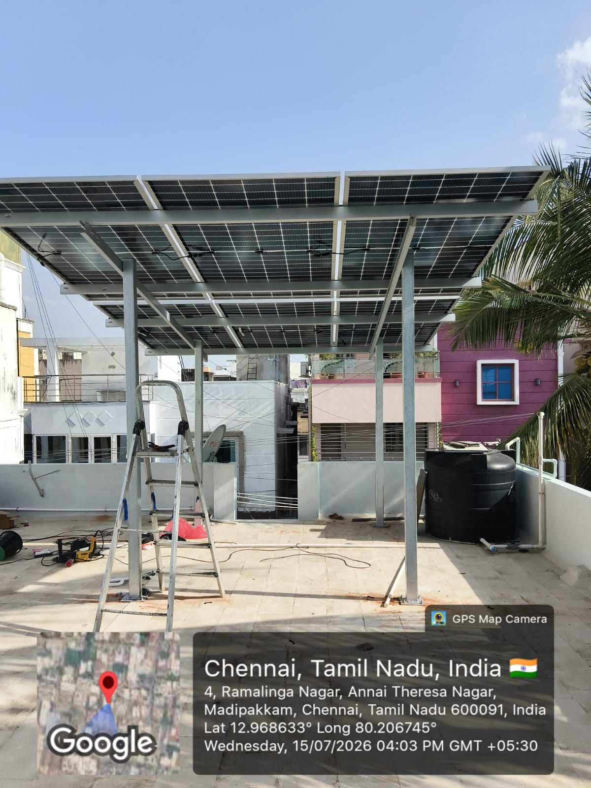 Solar installation at Madipakkam, Chennai — full-terrace solar canopy structure.