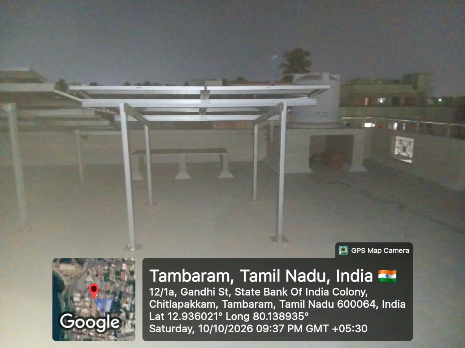 Home solar panel system on an elevated rooftop structure at State Bank of India Colony, Chitlapakkam, Tambaram, Chennai — installed by Gensolar Energy Pvt Ltd, photographed 10 October 2026.