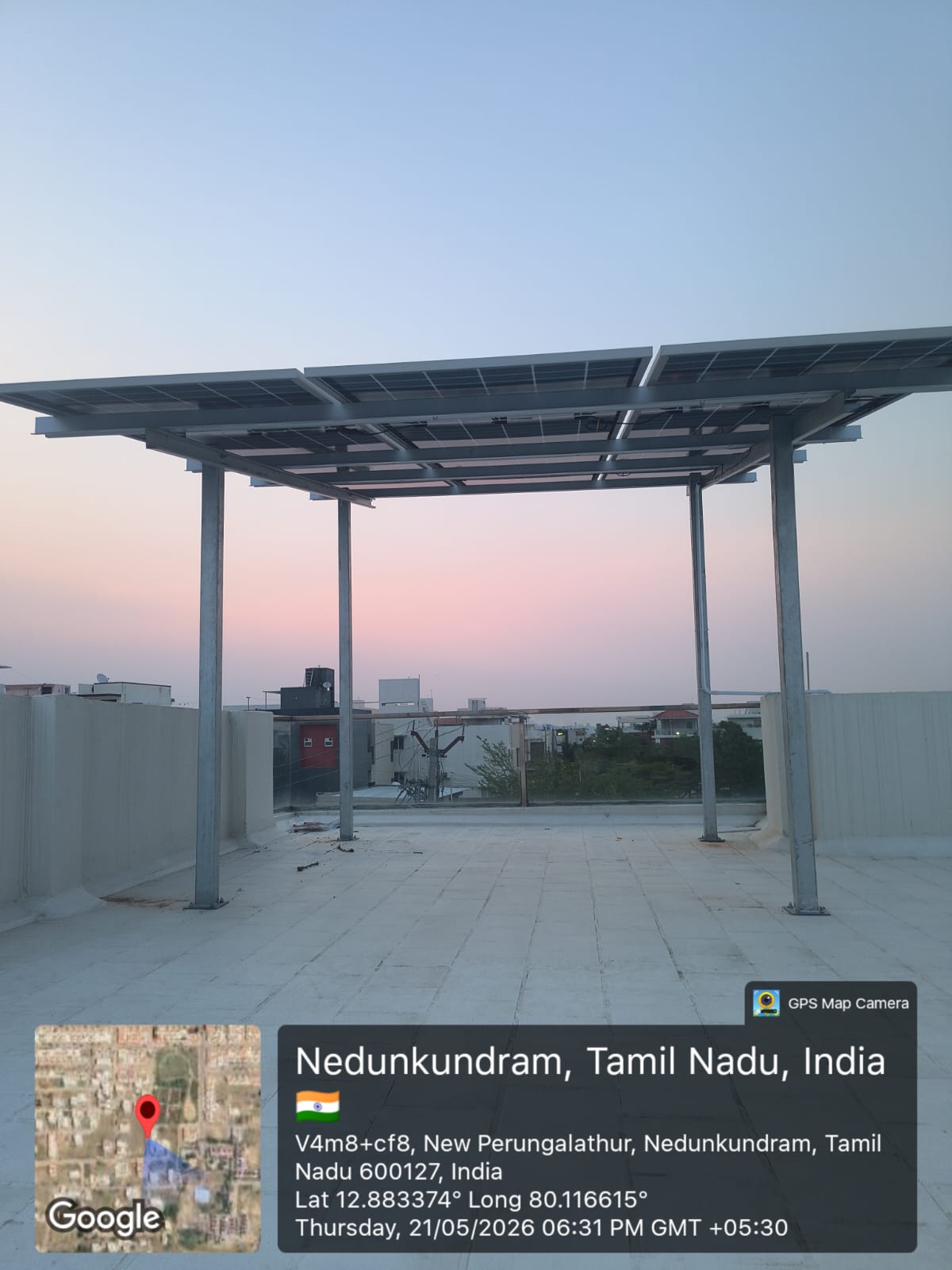 Solar installation at Nedunkundram, New Perungalathur — full-terrace elevated array.