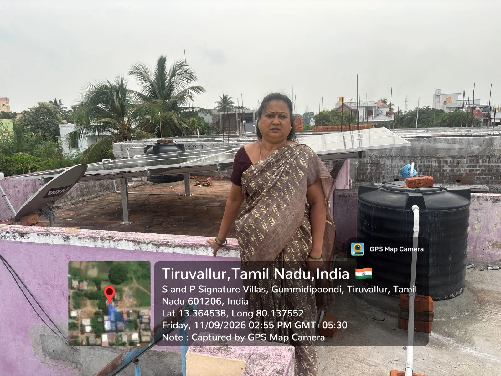 Completed rooftop solar array with homeowner at S and P Signature Villas, Gummidipoondi, Tiruvallur — residential solar panel installation by Gensolar Energy Pvt Ltd, photographed 11 September 2026.