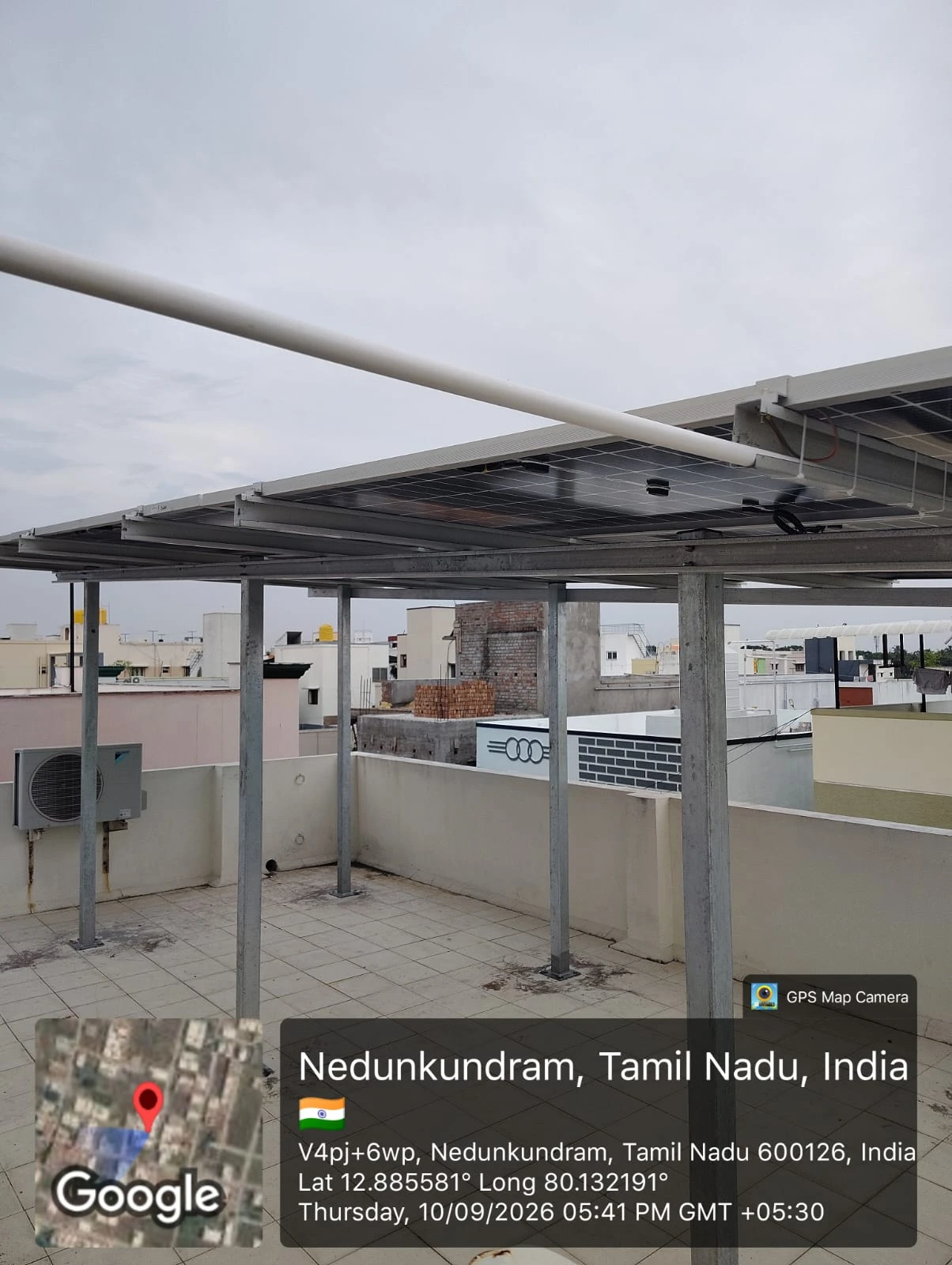 Elevated solar structure poles on a tiled rooftop at Nedunkundram, near Tambaram, Chennai — solar mounting installation by Gensolar Energy Pvt Ltd, photographed 10 September 2026.