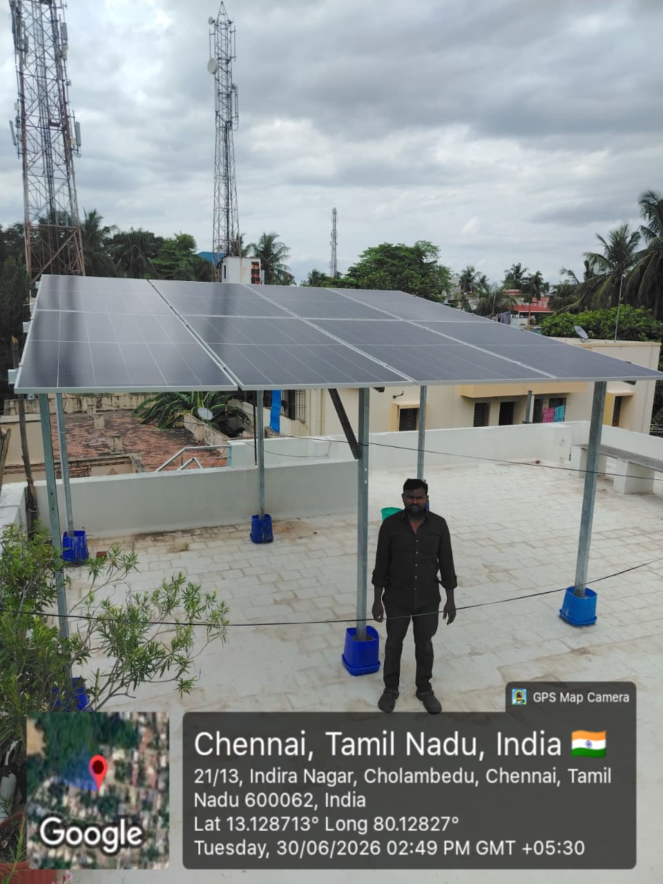 Solar installation at Cholambedu, Chennai — high-clearance elevated rooftop array.