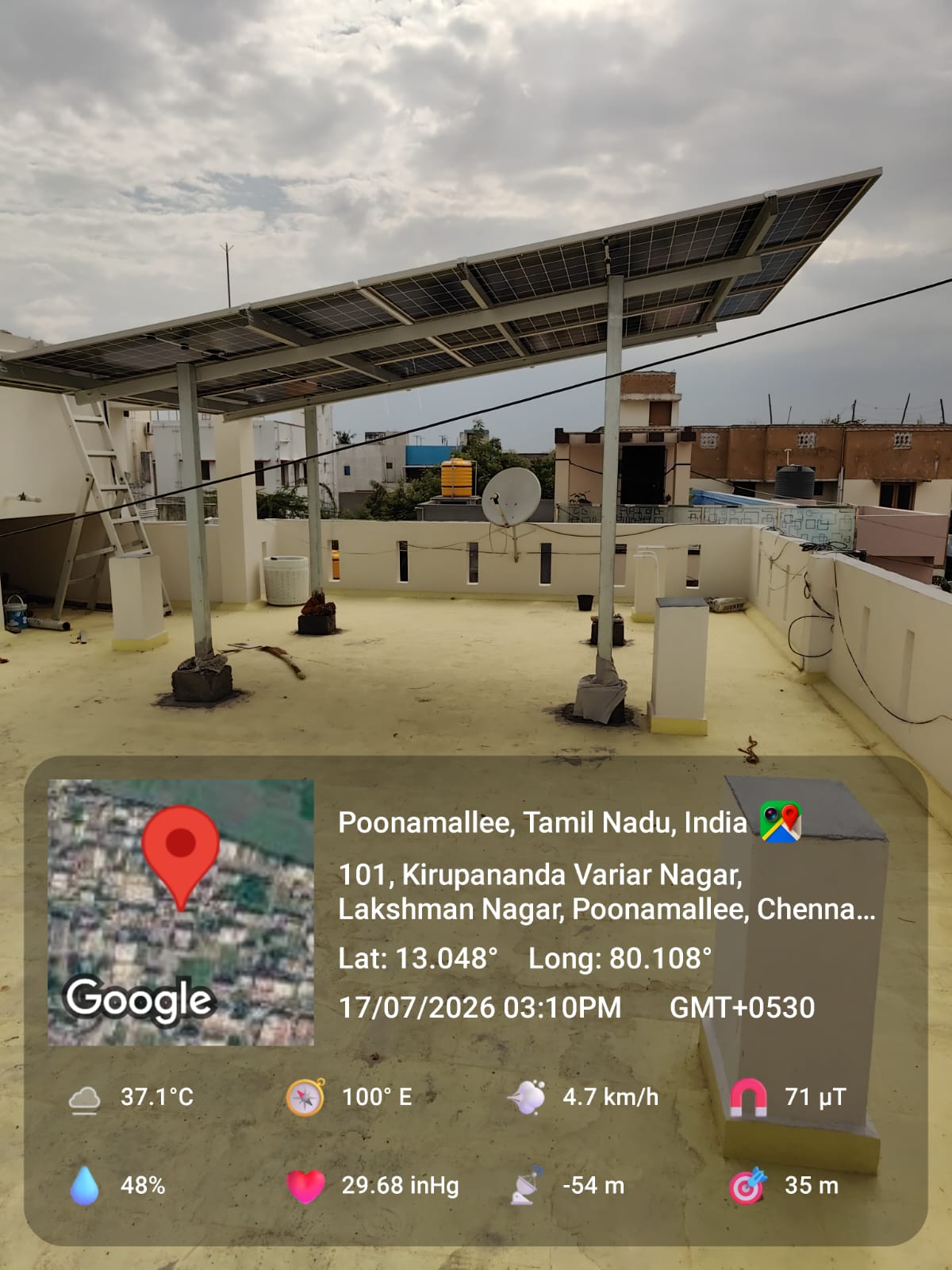 Solar installation at Poonamallee, Chennai — steep-tilt elevated rooftop array.