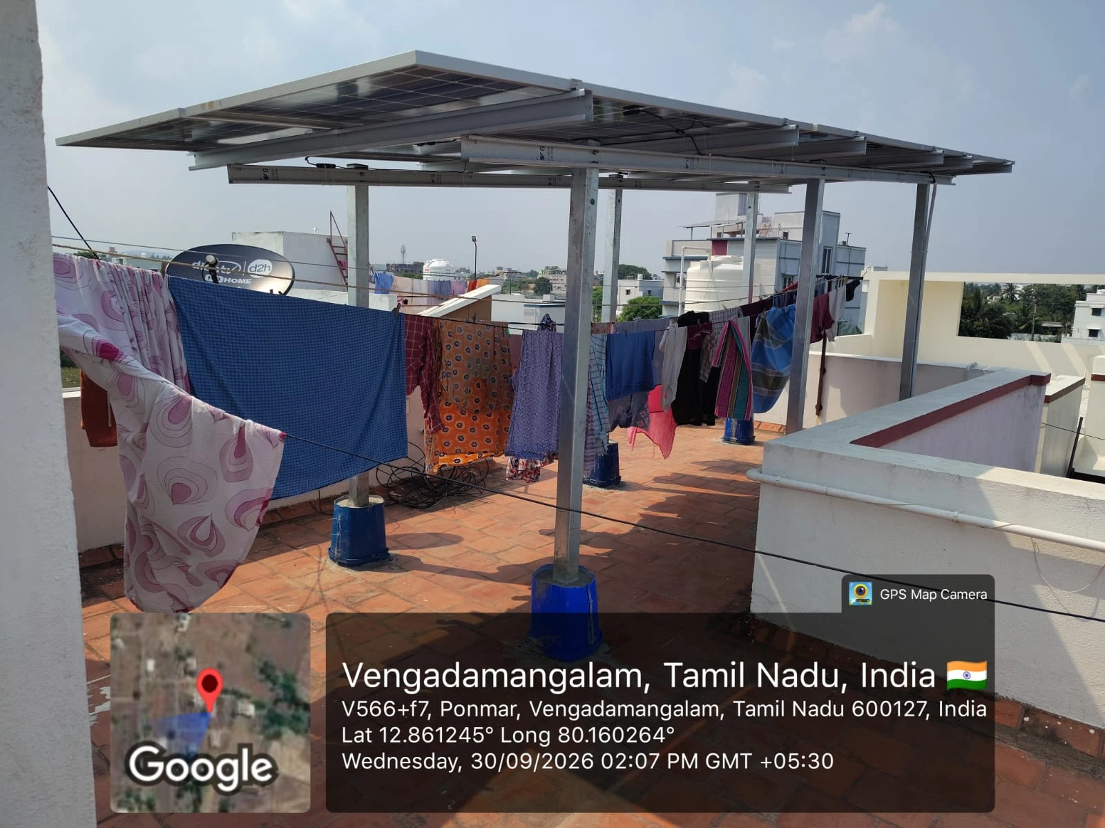 Elevated solar panel structure over a tiled rooftop at Ponmar, Vengadamangalam, Chennai — residential solar installation by Gensolar Energy Pvt Ltd, photographed 30 September 2026.