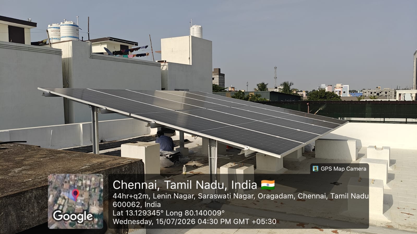 Solar installation at Oragadam, Chennai — tilt-mounted rooftop array on terrace.