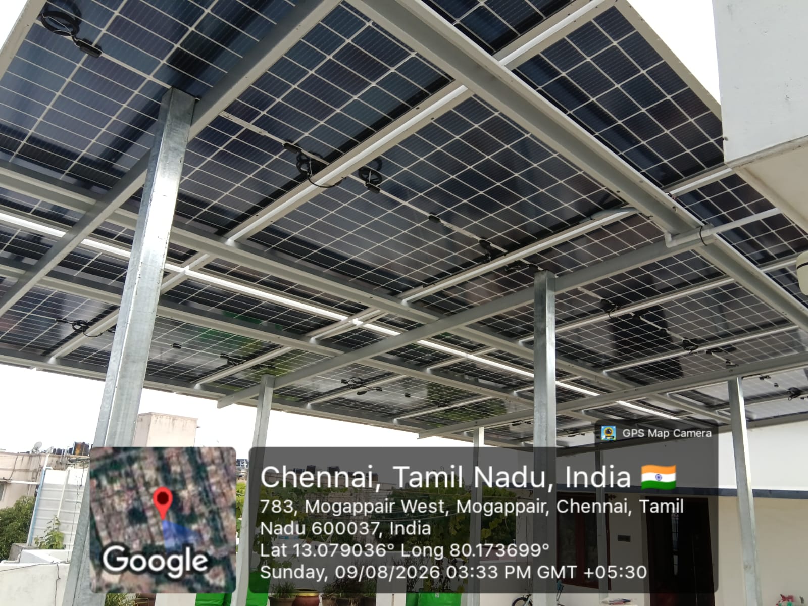 Geo-tagged rooftop solar installation at Mogappair West, Chennai — underside and mounting structure photographed 9 August 2026.