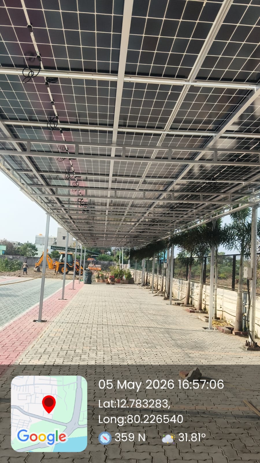 Solar installation at Kelambakkam — long walkway solar canopy for a commercial campus.
