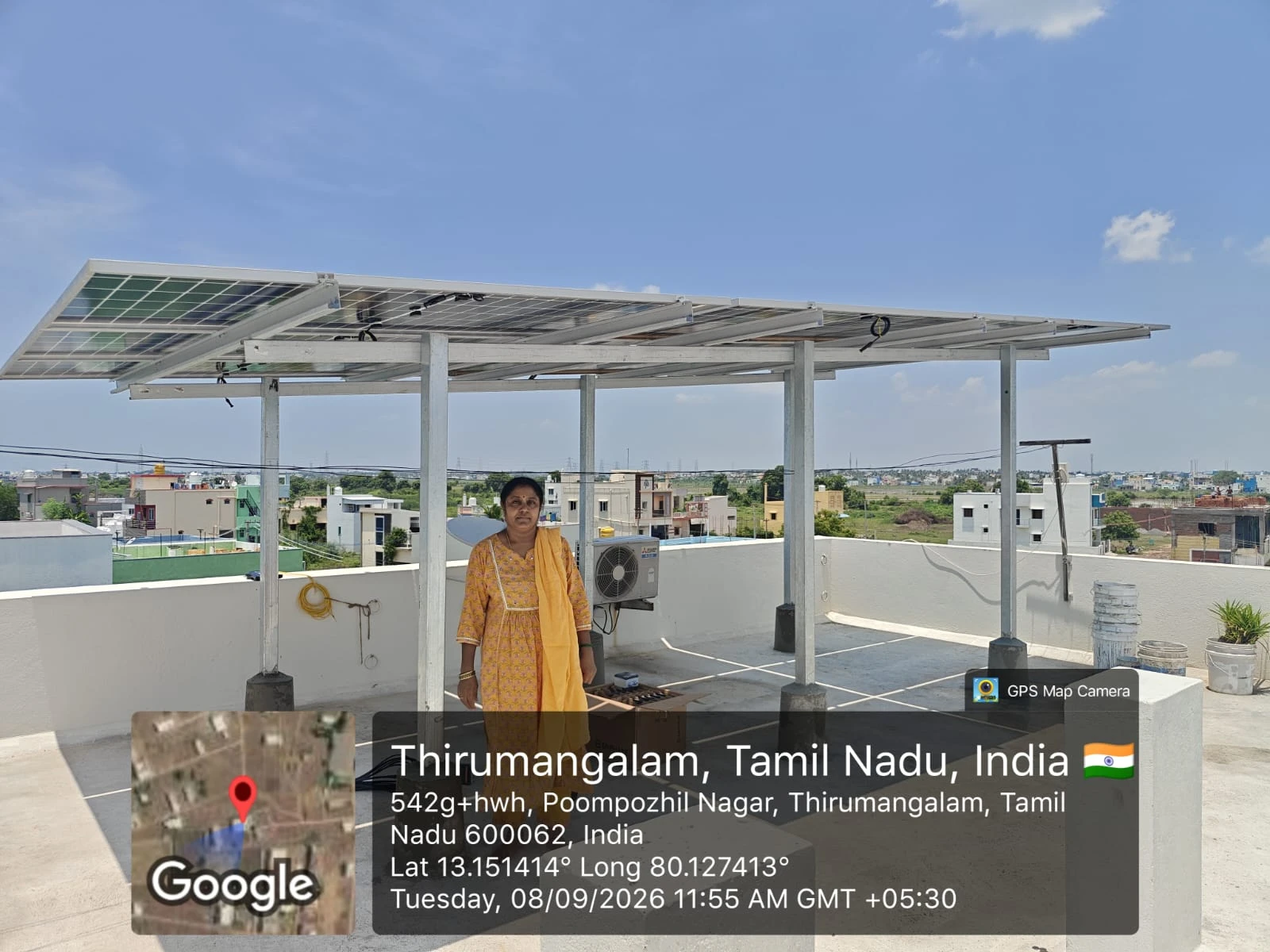 Elevated rooftop solar structure with homeowner at Poompozhil Nagar, Thirumangalam, Chennai — solar panel installation by Gensolar Energy Pvt Ltd, photographed 8 September 2026.