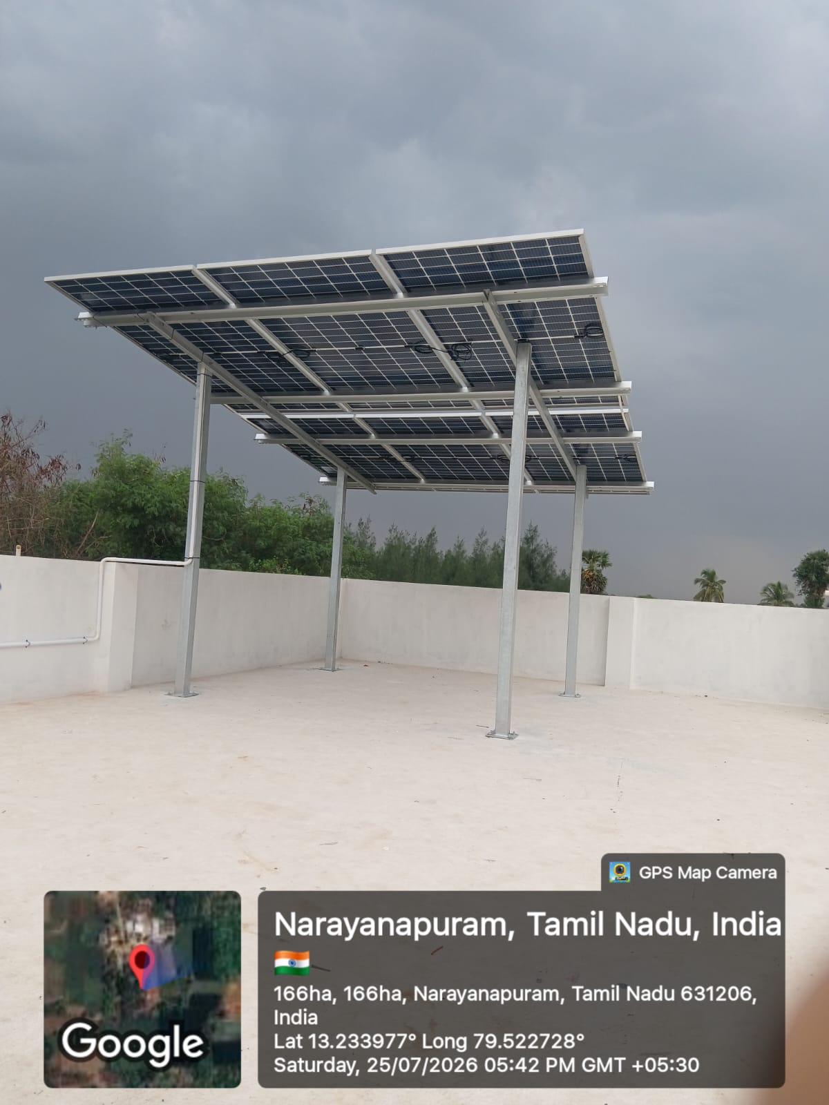 Solar installation at Narayanapuram — high-clearance elevated bifacial array.