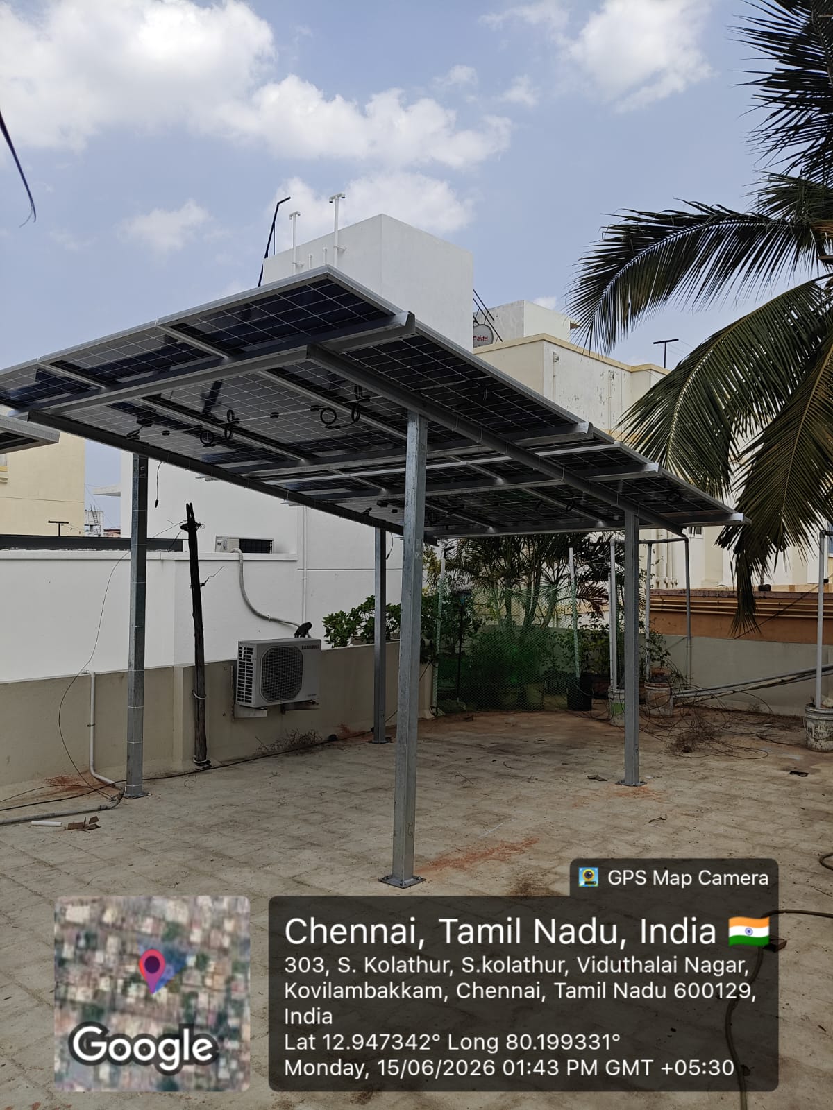 Solar installation at Kovilambakkam, Chennai — elevated rooftop shed-mount array.
