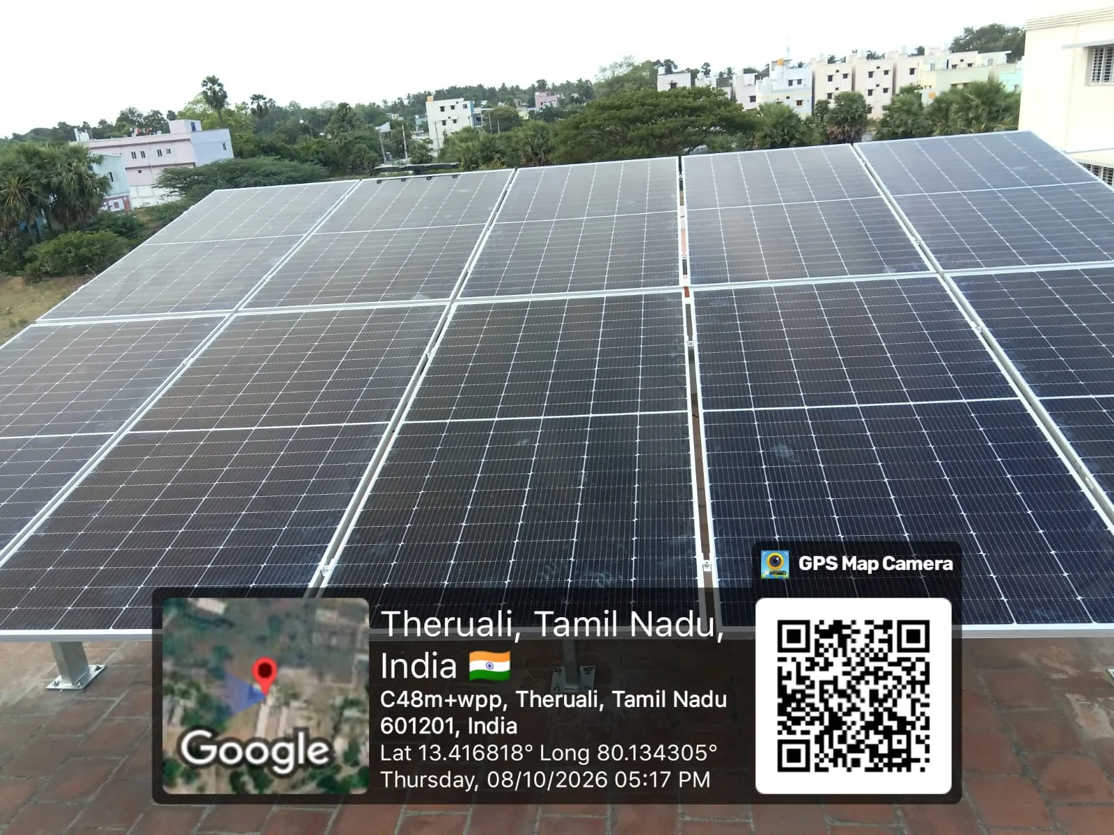 Large rooftop solar panel array across tiled roofs at Theruali, Ponneri, Tiruvallur district — residential solar installation by Gensolar Energy Pvt Ltd, photographed 8 October 2026.