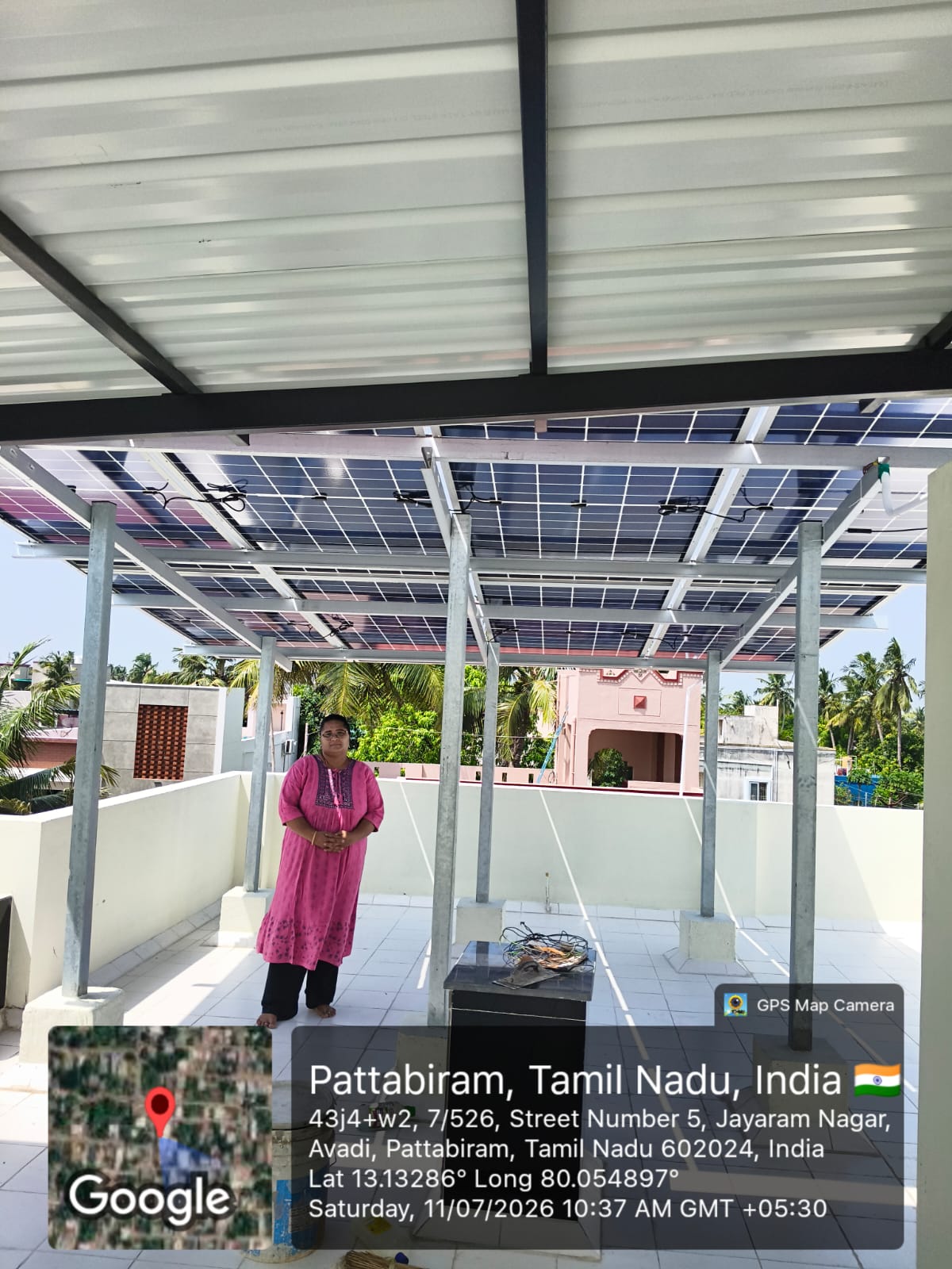 Solar installation at Pattabiram, Chennai — rooftop array under shaded terrace roofing.